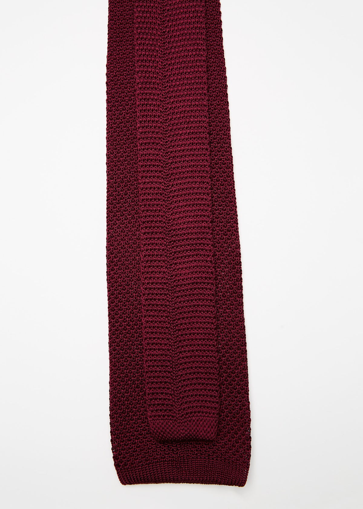 Paris Silk Knit Tie in burgundy, close-up flat lay arranged diagonally