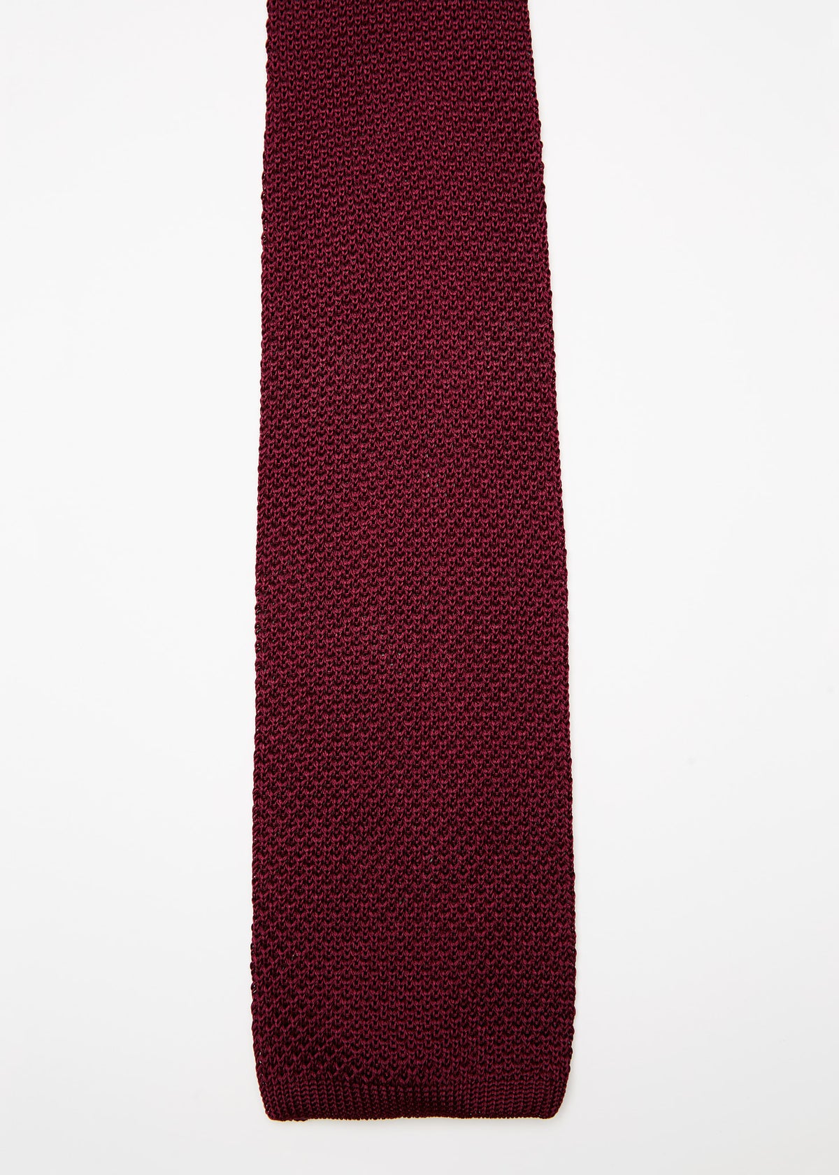 Paris Silk Knit Tie in the Burgundy colourway, straight flat lay on a plain background