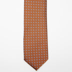 Seoul Tie in brown dotted pattern, flat lay on a plain background