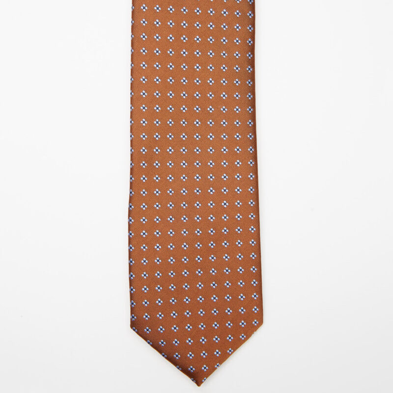 Seoul Tie in brown dotted pattern, flat lay on a plain background