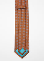 Seoul Tie in brown dotted pattern, close-up showing keeper loop and turquoise reverse