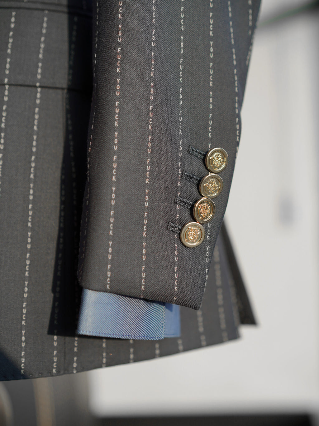The No Filter Navy Pinstripe Suit, close-up of the cuff buttons and blue lining
