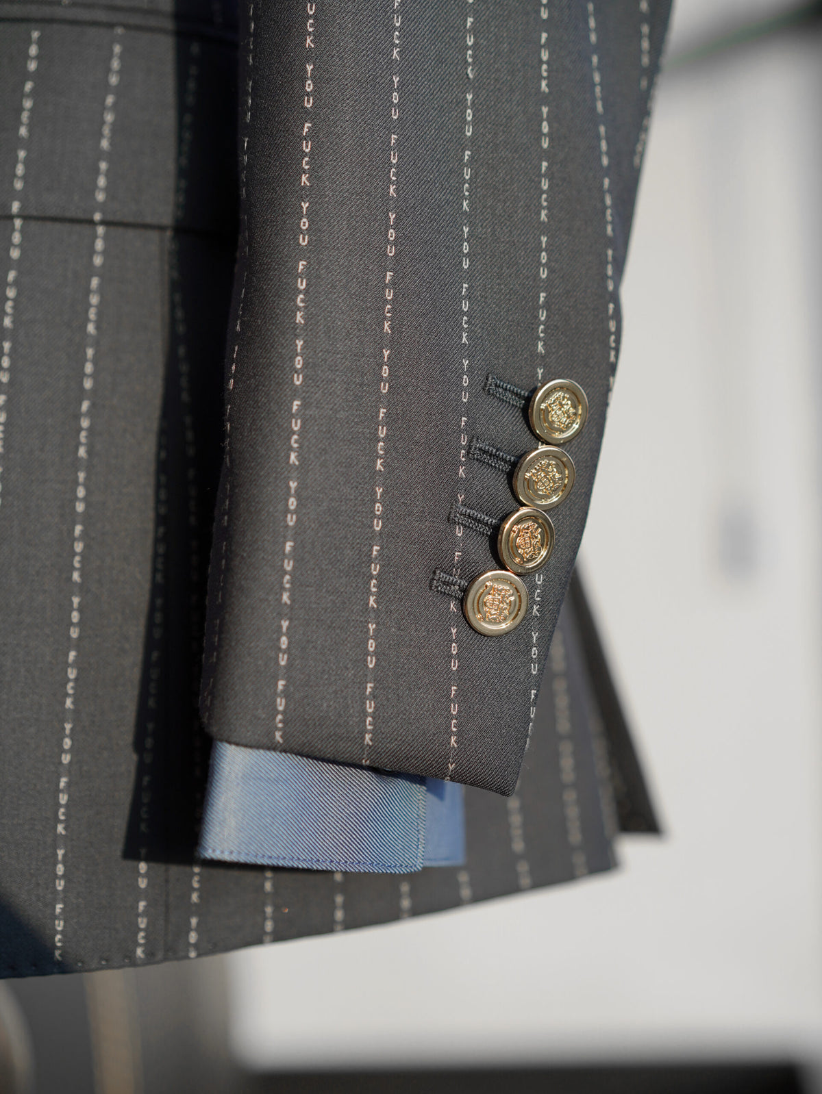 The No Filter Navy Pinstripe Suit, close-up of the cuff buttons and blue lining
