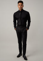Our Perfect Black Shirt worn with a black tie and trousers, full-length front view