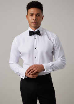 Glamorous Tuxedo Shirt with black bow tie and studs, front view, hands clasped