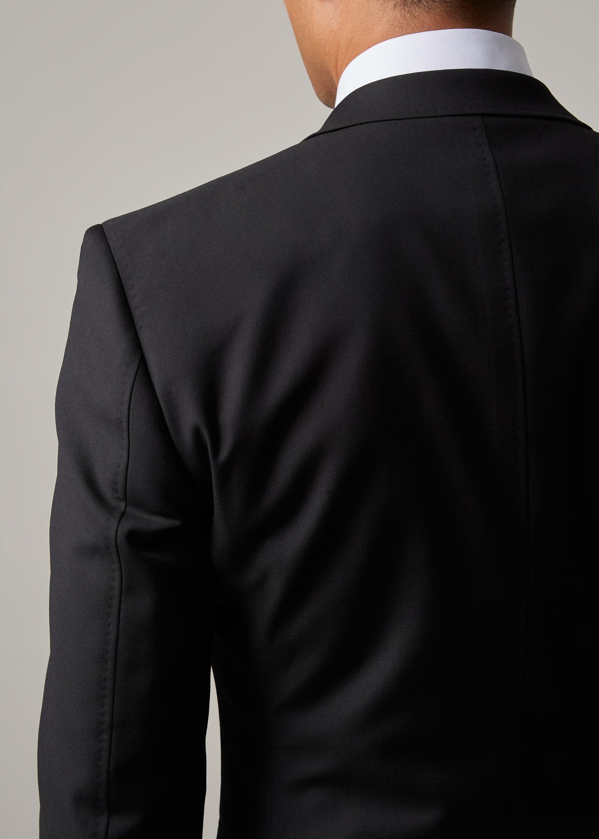 Midnight Milano The Ultimate Black Suit, back view close-up of the shoulder and collar