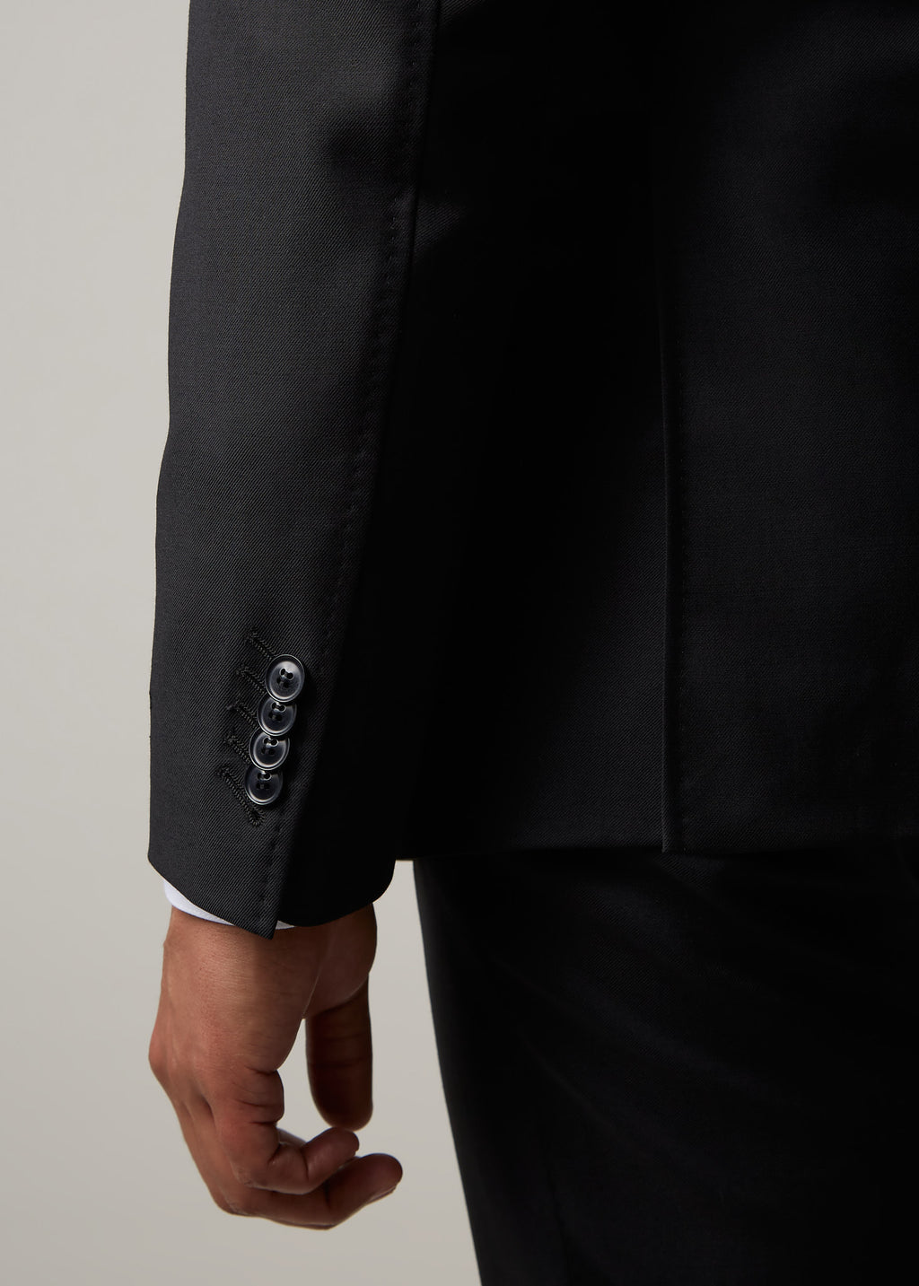 Midnight Milano The Ultimate Black Suit, back view close-up of the sleeve cuff
