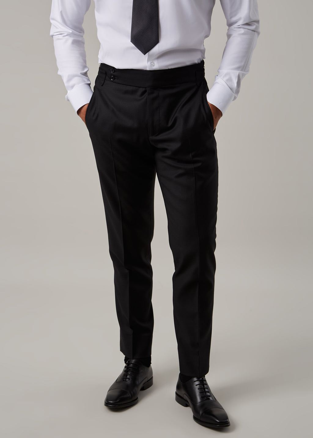 Midnight Milano The Ultimate Black Suit trousers worn with a shirt and tie, no jacket
