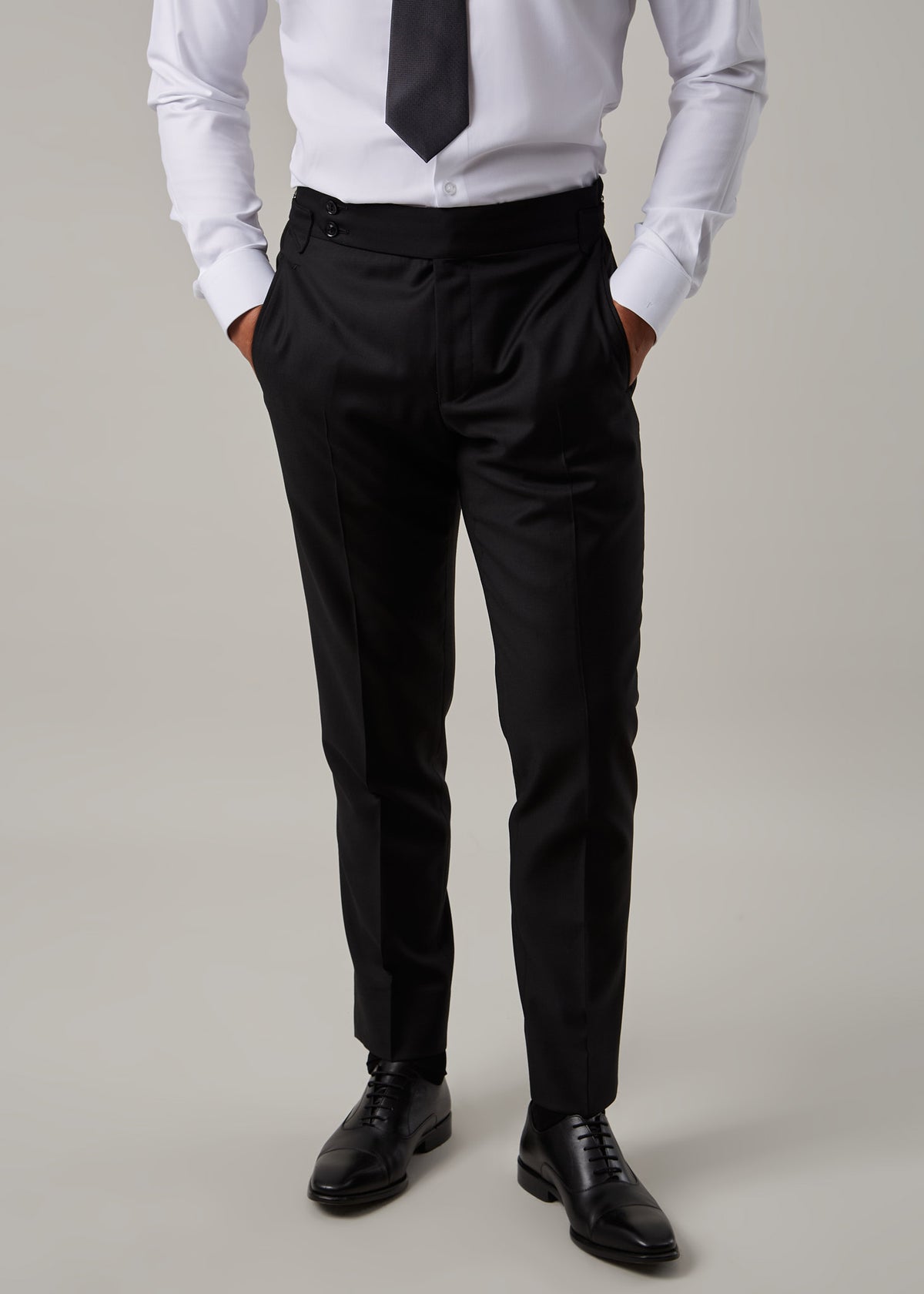 Midnight Milano The Ultimate Black Suit trousers worn with a shirt and tie, no jacket