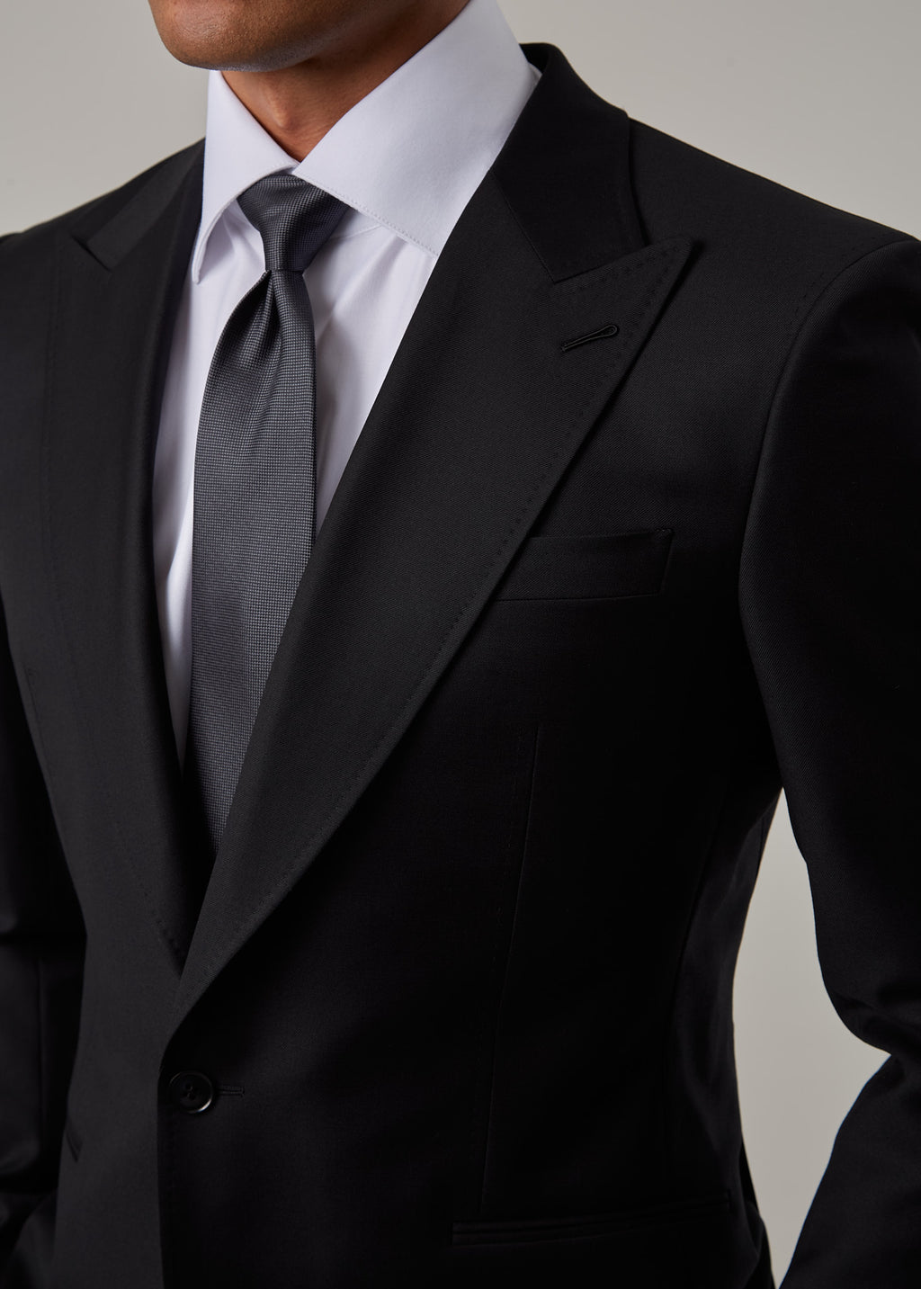 Midnight Milano The Ultimate Black Suit, closer crop of the peak lapel and tie knot