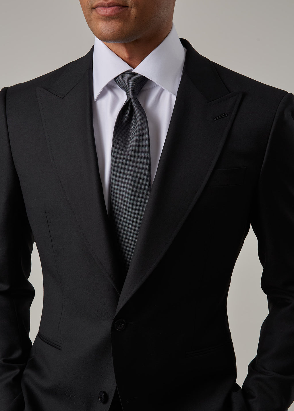 Midnight Milano The Ultimate Black Suit, close-up of the lapel, tie and chest pocket