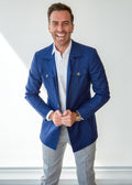 Blue Safari Jacket on a model, full front view with hands on the button