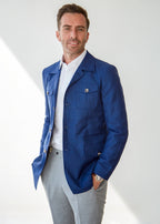Blue Safari Jacket on a model, three-quarter view with hand in pocket