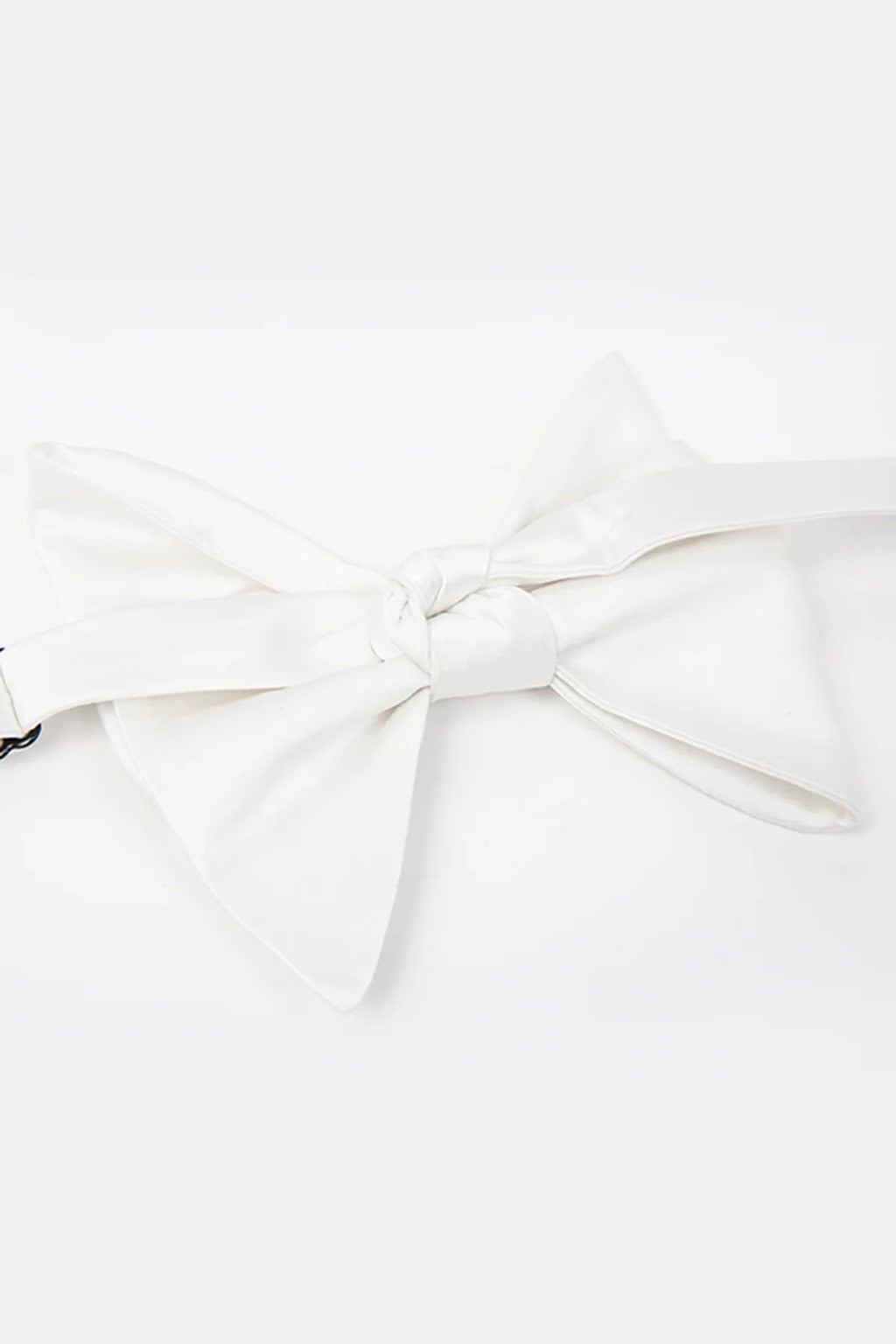 White floppy self-tie bow tie, angled view of the knot