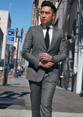 Ginza Greenway Suit worn by a model walking on a city street, front view