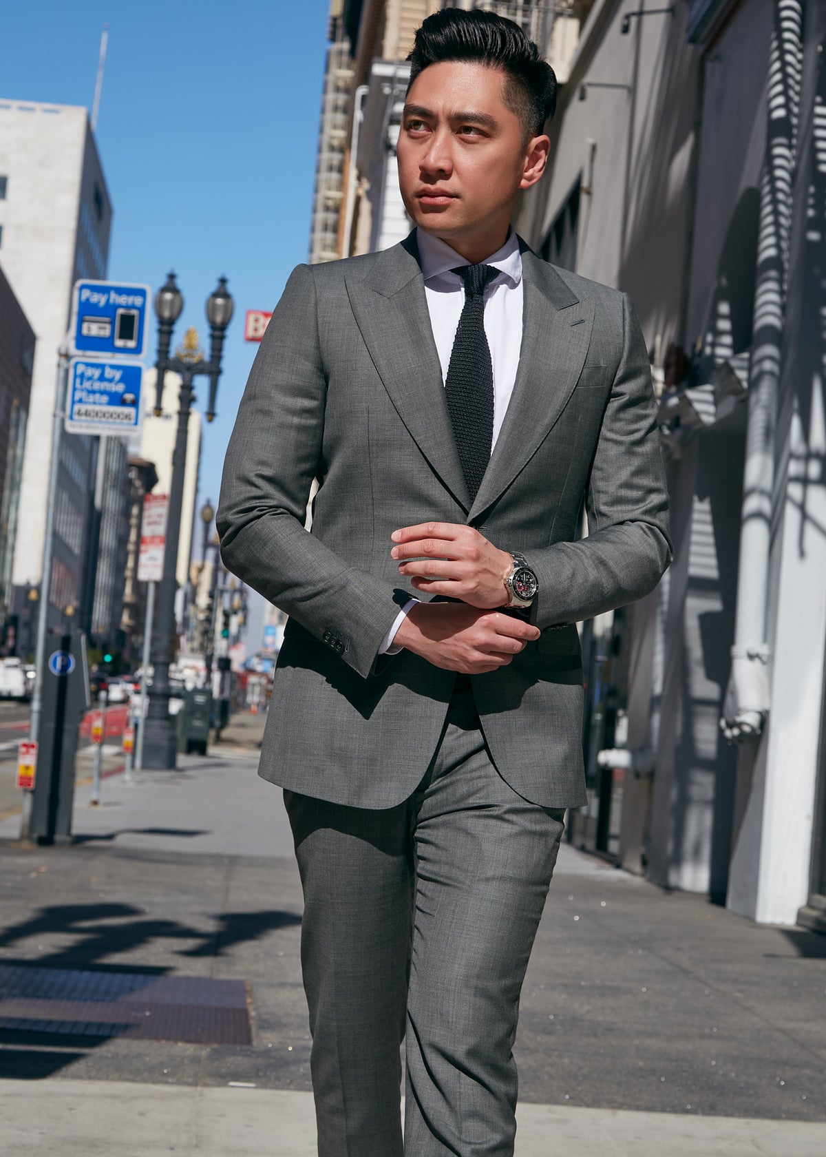 Ginza Greenway Suit worn by a model walking on a city street, front view