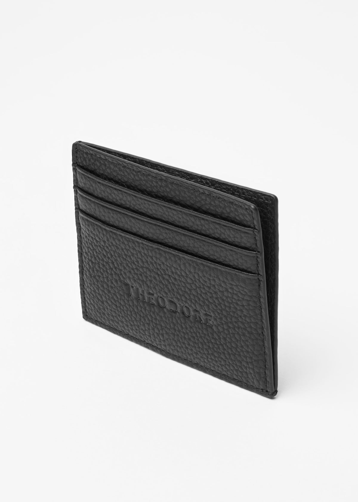 Fagan Leather Card Holder standing at an angle with card slots fanned open