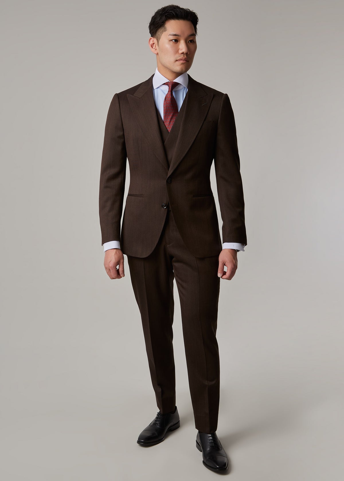 Lexington Brown Suit worn buttoned with waistcoat and tie, full front view on a model
