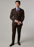 Lexington Brown Suit, full front view on a model with hands clasped