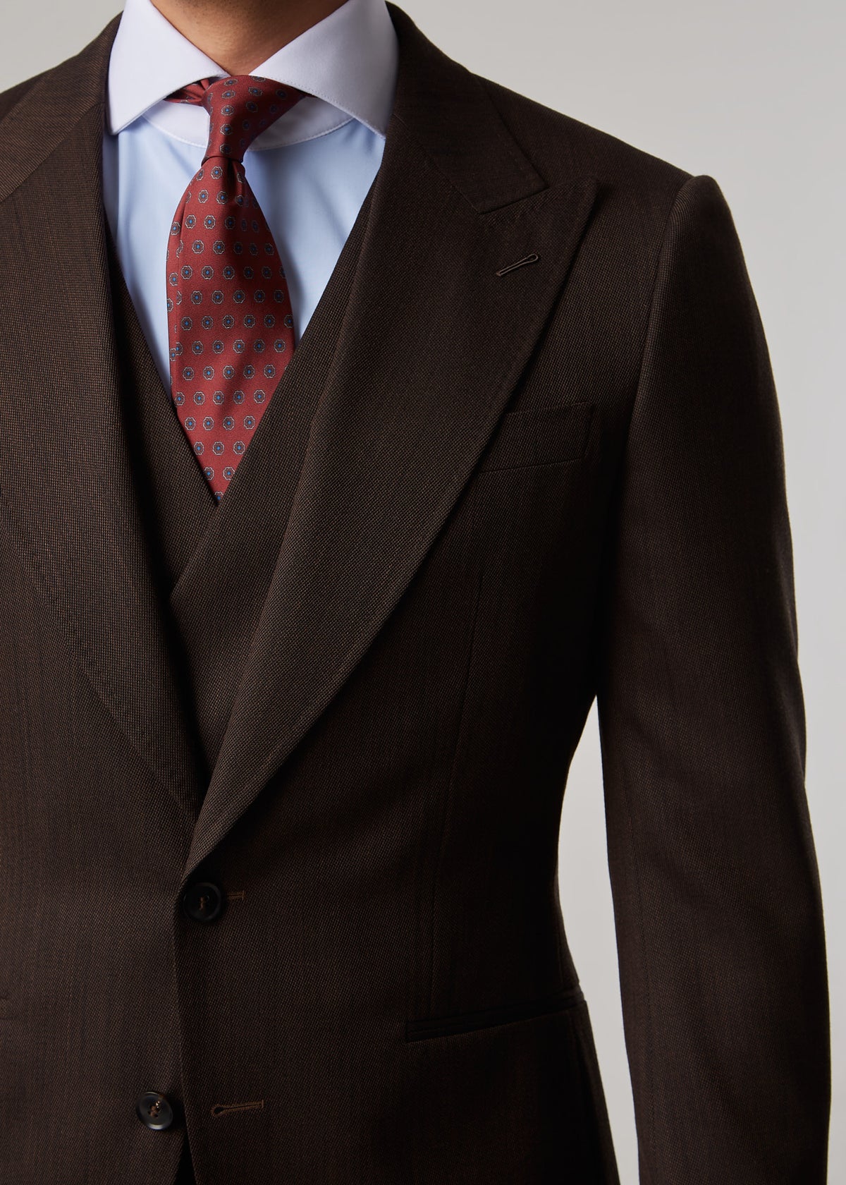 Lexington Brown Suit, close crop of the chest pocket and peak lapel