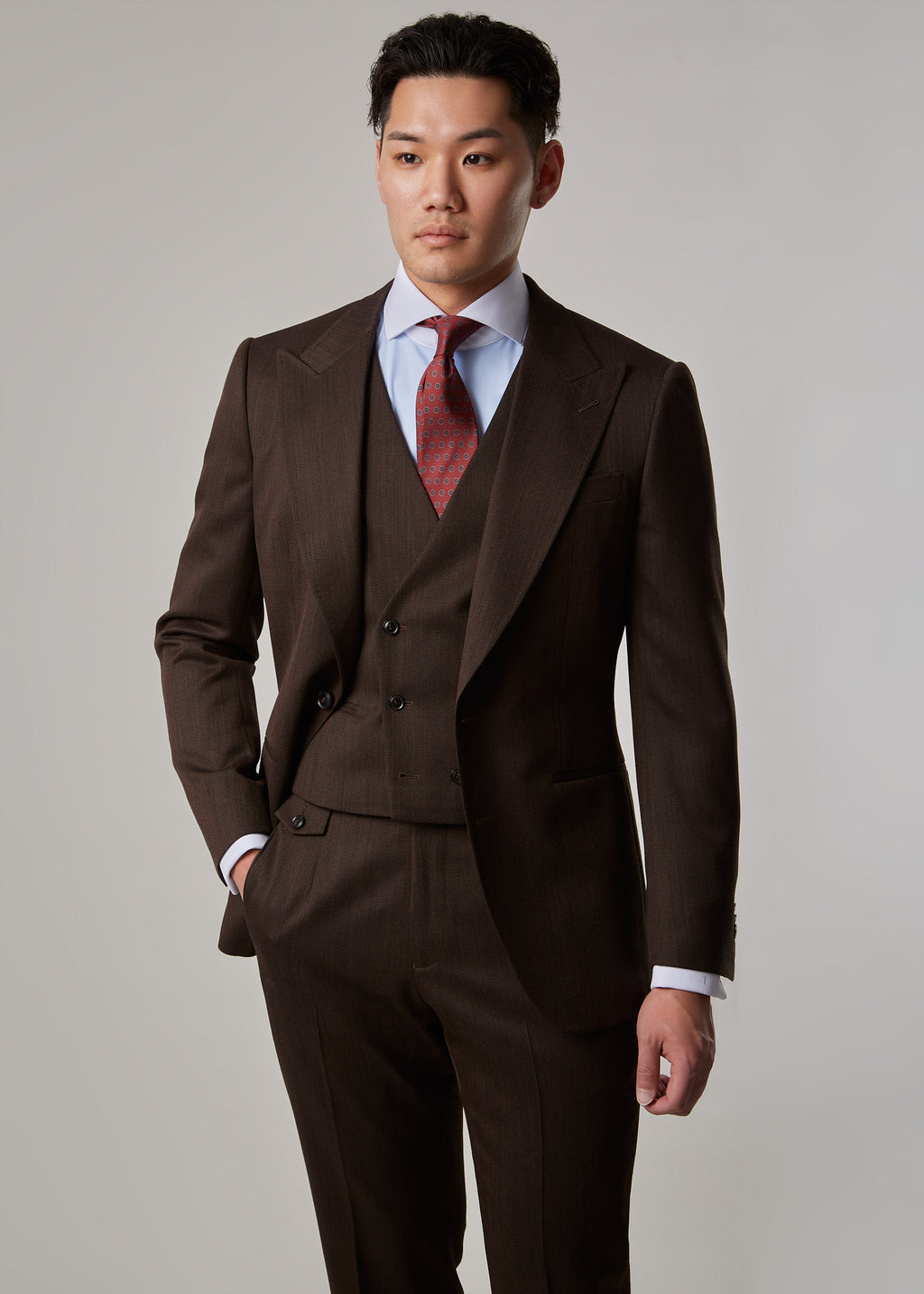 Lexington Brown Suit, torso view on a model with one hand in the trouser pocket