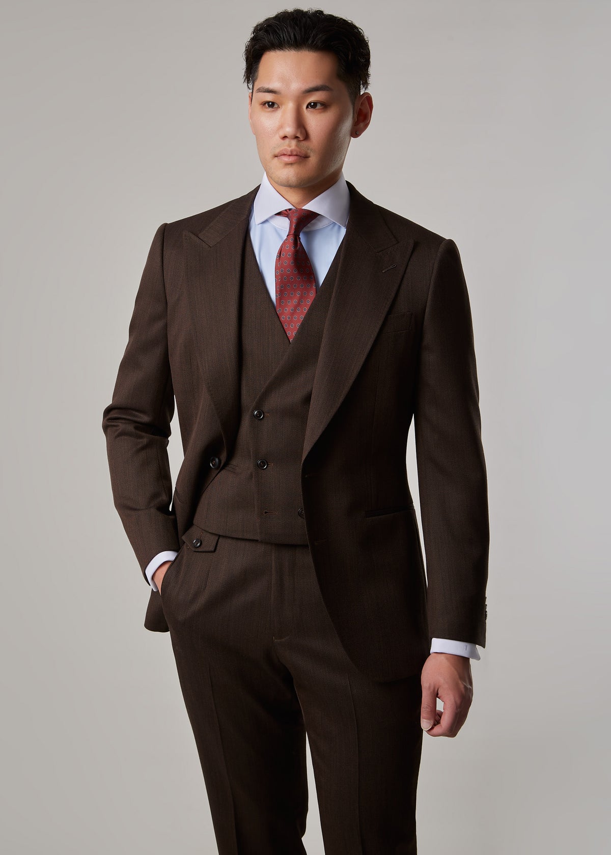 Lexington Brown Suit, torso view on a model with one hand in the trouser pocket
