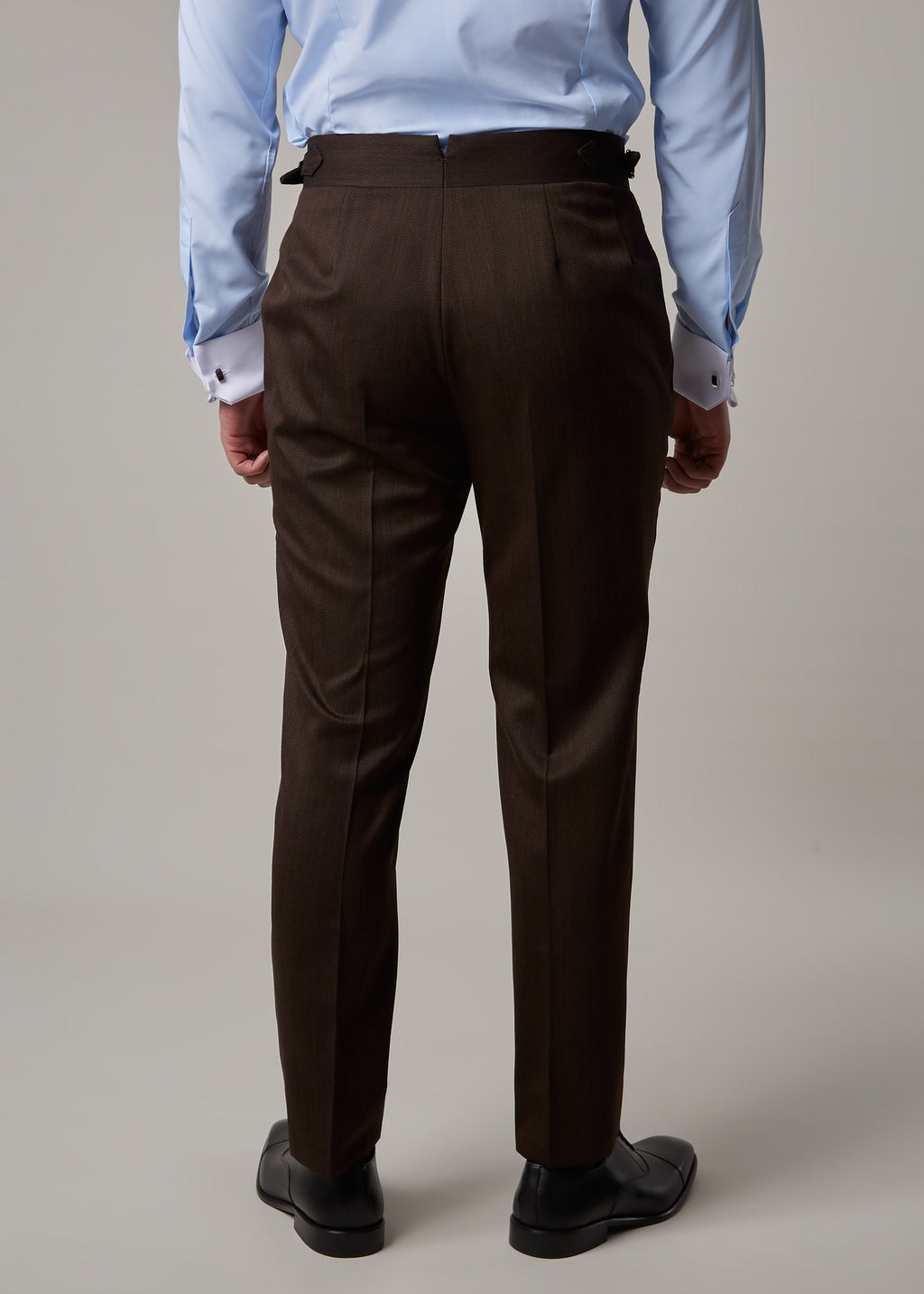 Lexington Brown Suit trousers, close-up of the side-adjuster waistband tab