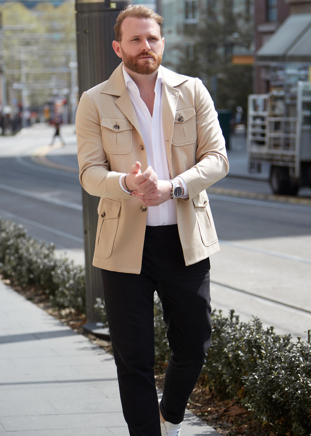 Cream Safari Jacket worn open over a white shirt, outdoor street setting on a model