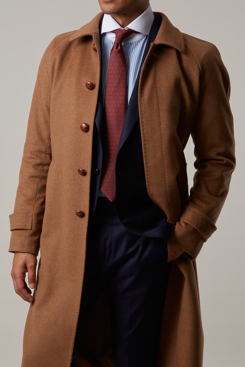 Toasty Truffle Cashmere Blend Overcoat close-up worn open with hand in trouser pocket