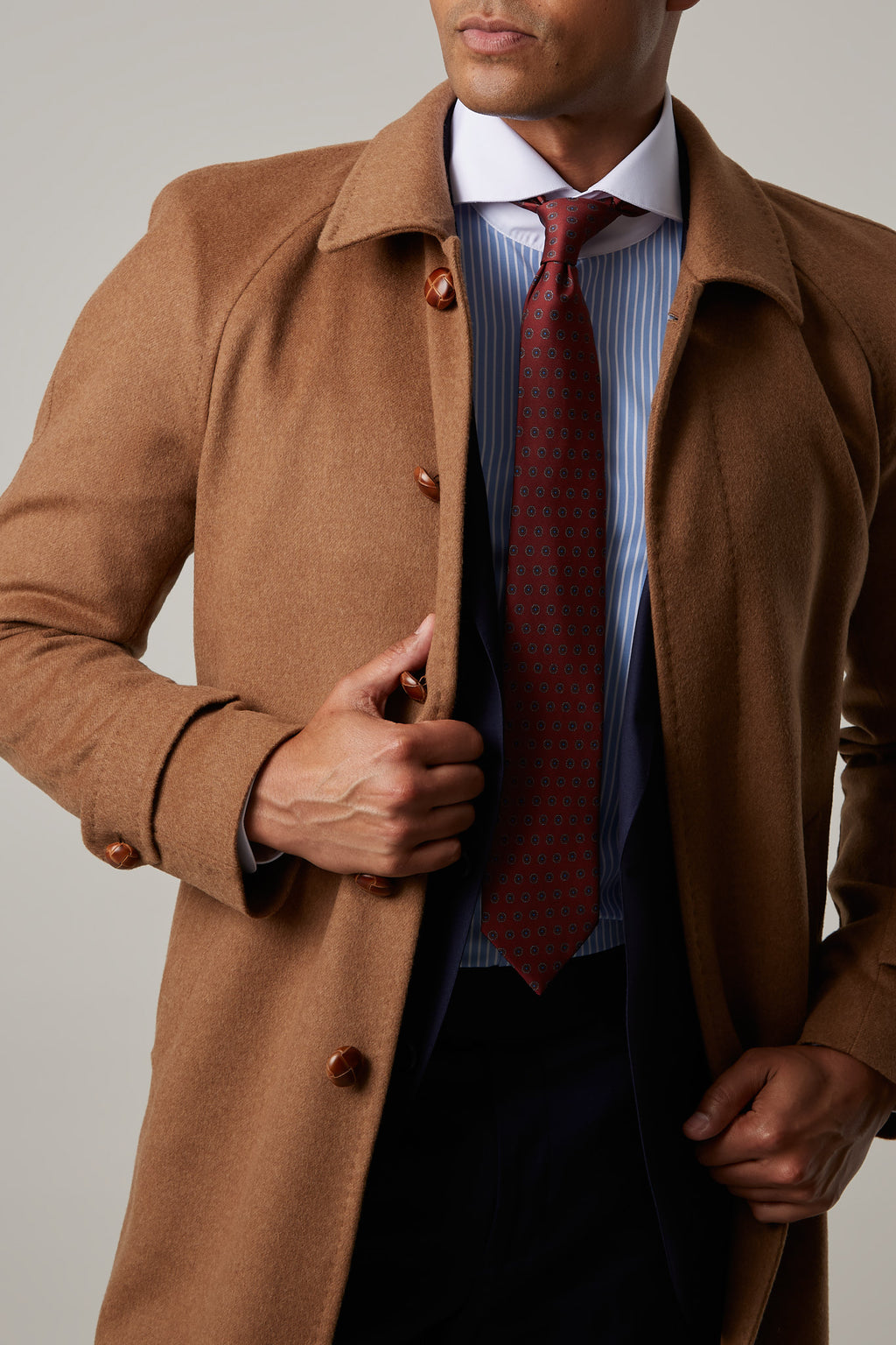 Toasty Truffle Cashmere Blend Overcoat close-up with both hands holding it open