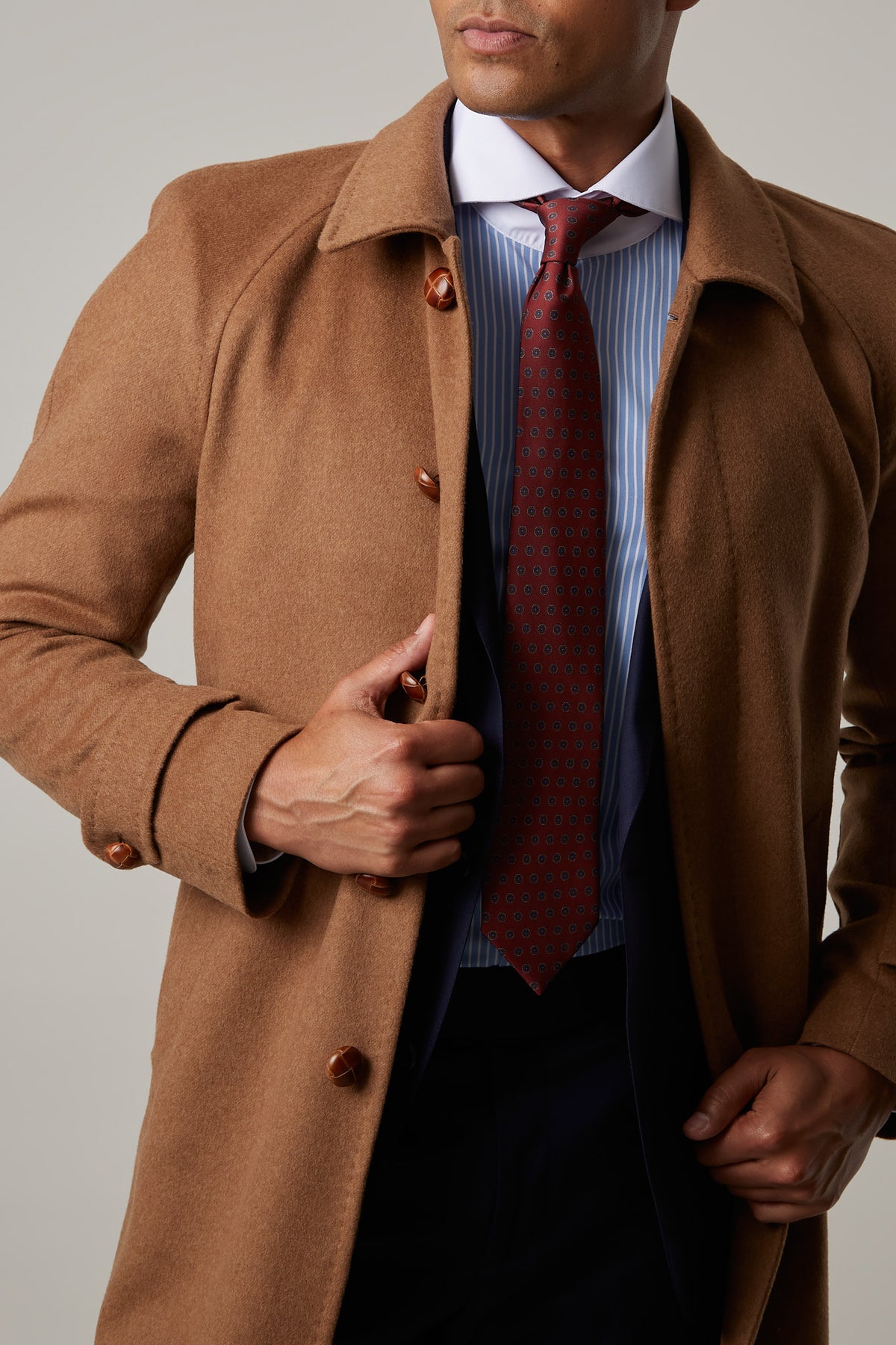 Toasty Truffle Cashmere Blend Overcoat close-up with both hands holding it open
