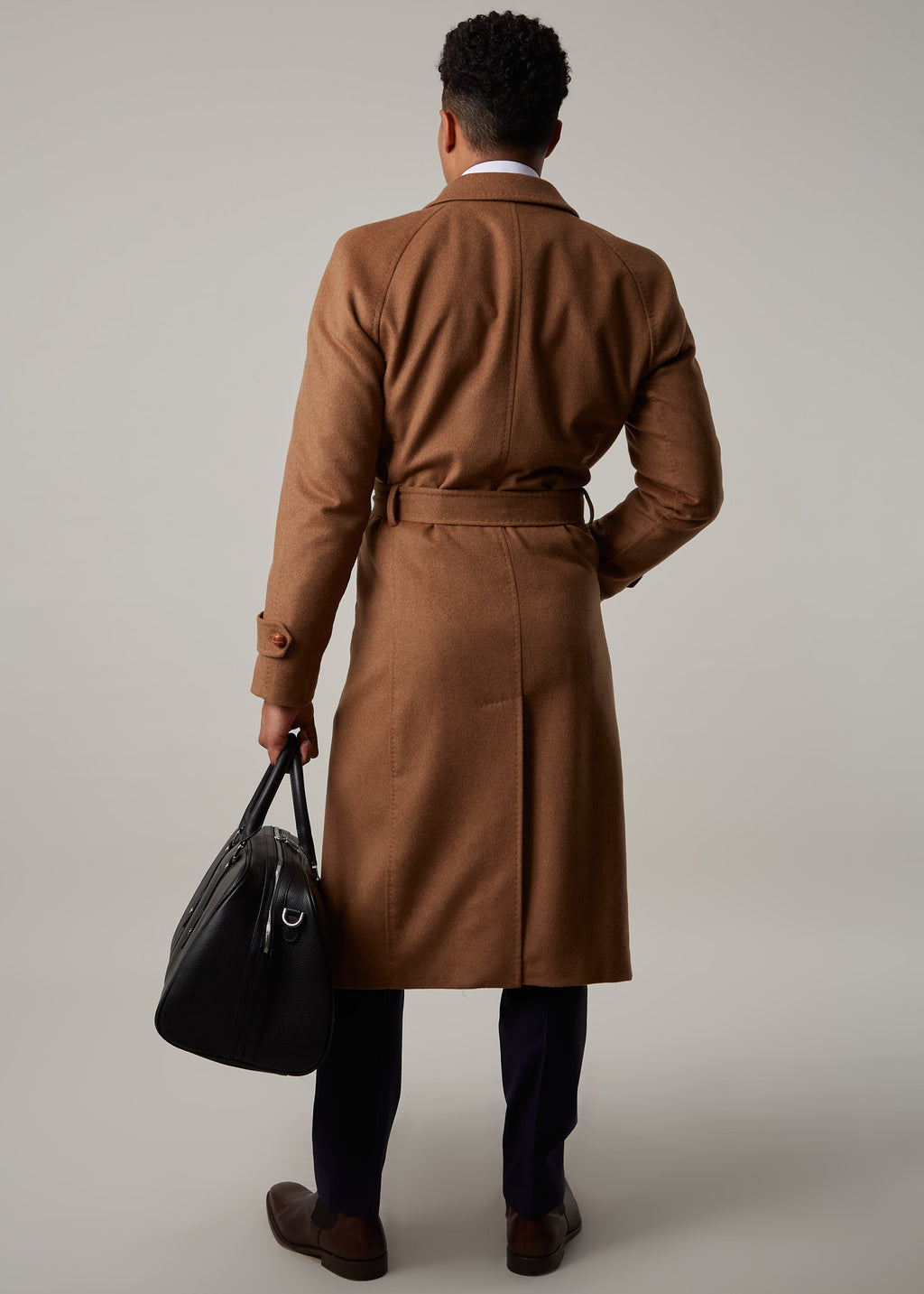 Toasty Truffle Cashmere Blend Overcoat back view walking with a black bag