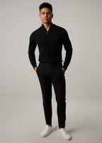 Gotham Noir Black Chinos, full-length front view styled with a black quarter-zip jumper