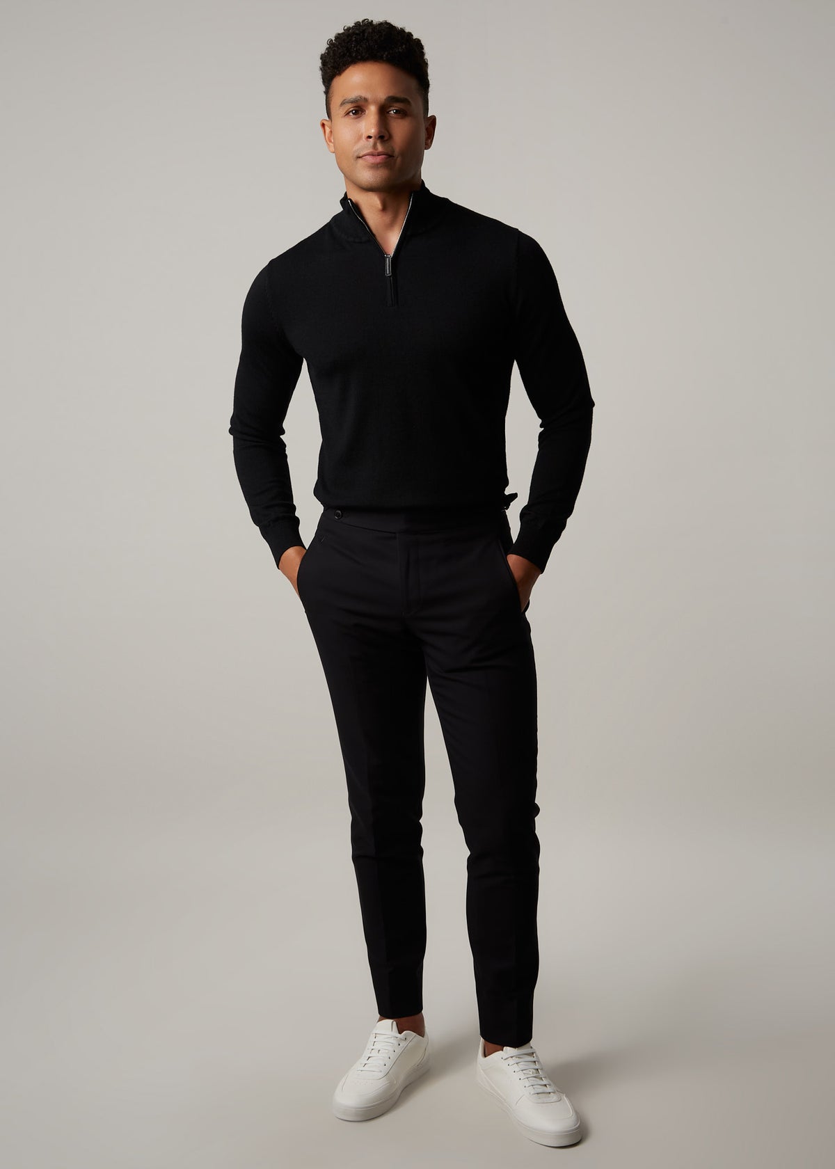 Gotham Noir Black Chinos, full-length front view styled with a black quarter-zip jumper