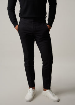 Gotham Noir Black Chinos, front view from the waist down on a model