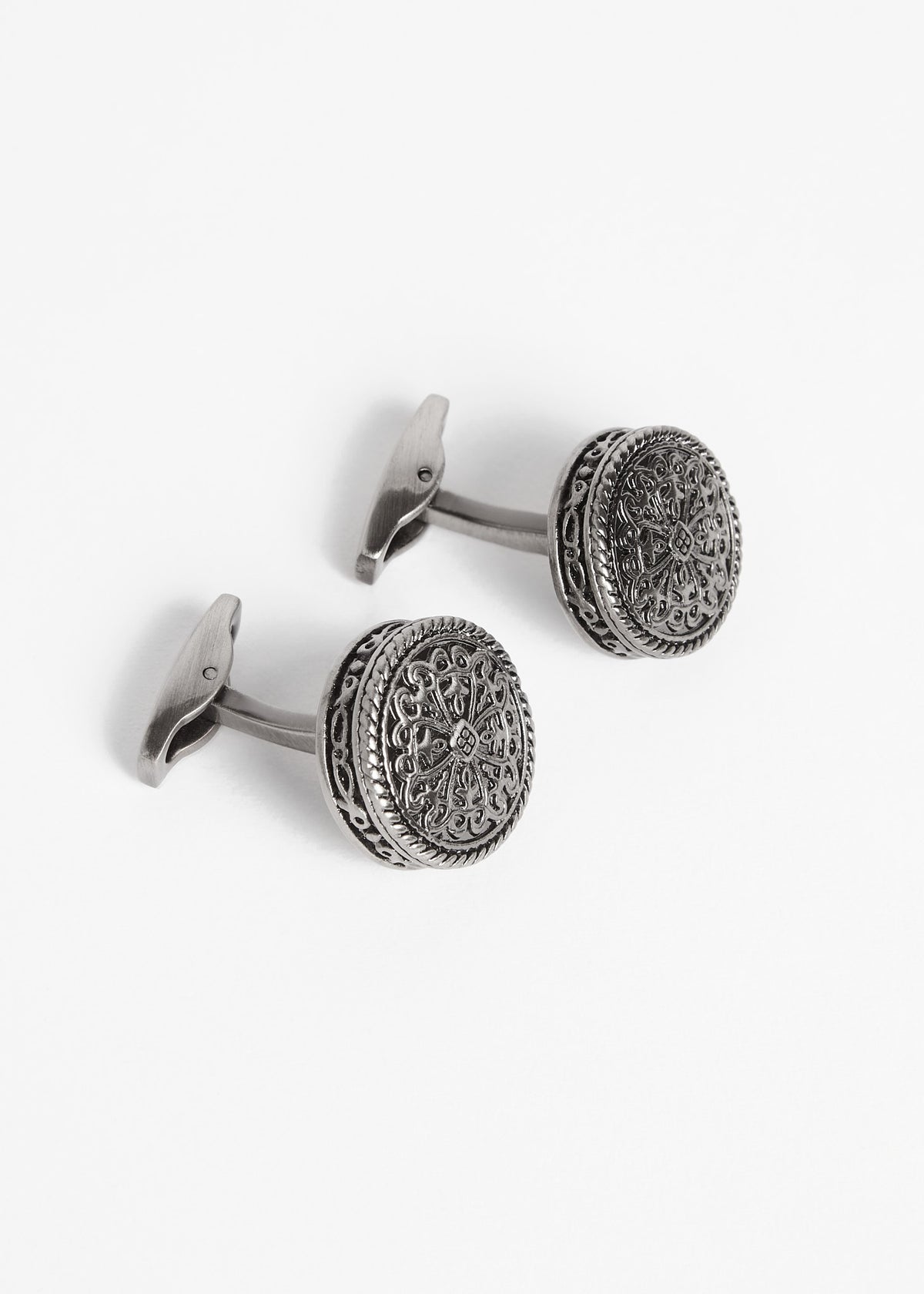 Gunmetal Token Cufflinks shown at an angle with the toggle bars visible