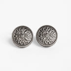 Gunmetal Token Cufflinks, front-on flat lay of the engraved medallion faces