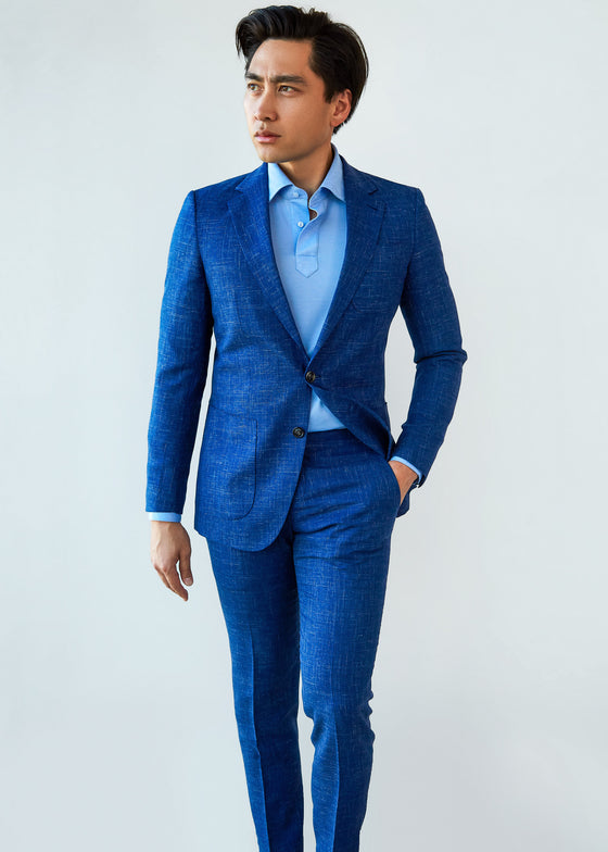 Bombay Blue Linen Blend Suit worn open over a pale blue shirt, front view on a model