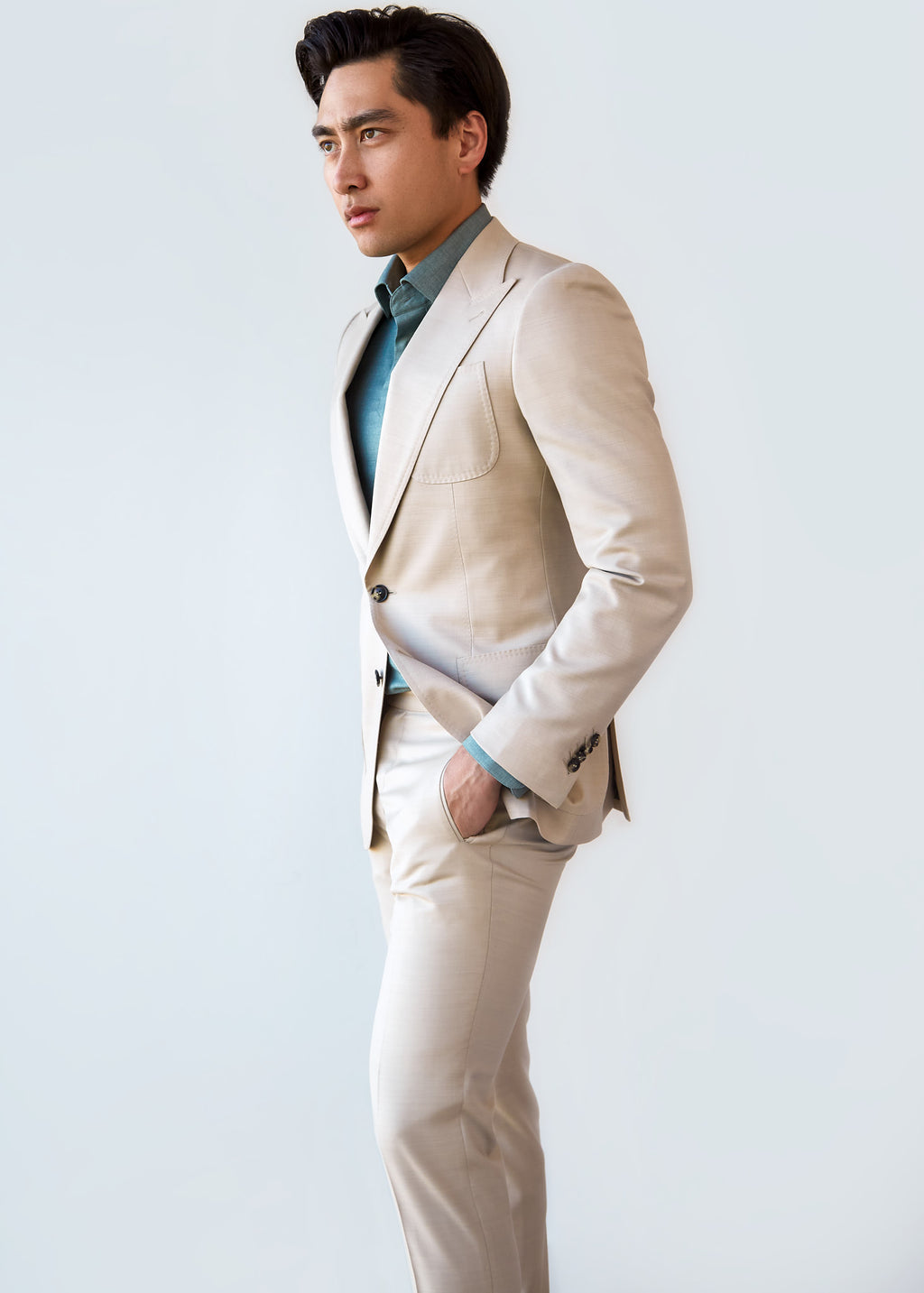 San Polo Cream Wool Suit, side profile portrait crop with a hand in the pocket