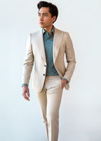 San Polo Cream Wool Suit, a model walks with a teal shirt beneath, hand in pocket