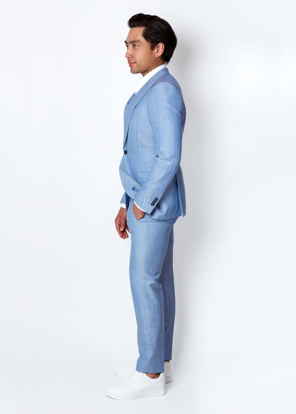 Aegean Sky Blue Herringbone Suit, full-length side profile view on a model