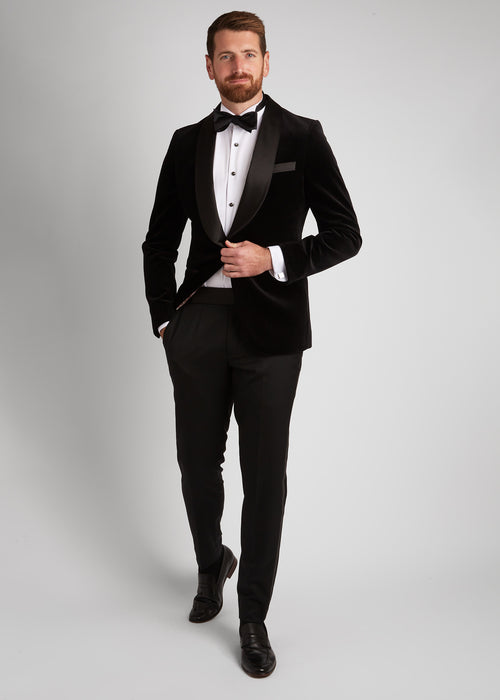 Artillery Black Velvet Tuxedo, standing shot of a model fastening the jacket button