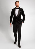 Artillery Black Velvet Tuxedo, full-length shot of a model walking with a hand in the pocket