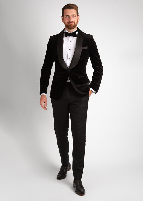Artillery Black Velvet Tuxedo, full-length shot of a model walking with a hand in the pocket