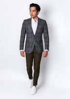 Olive Green Chino Pants styled with a checked blazer, full-length walking pose