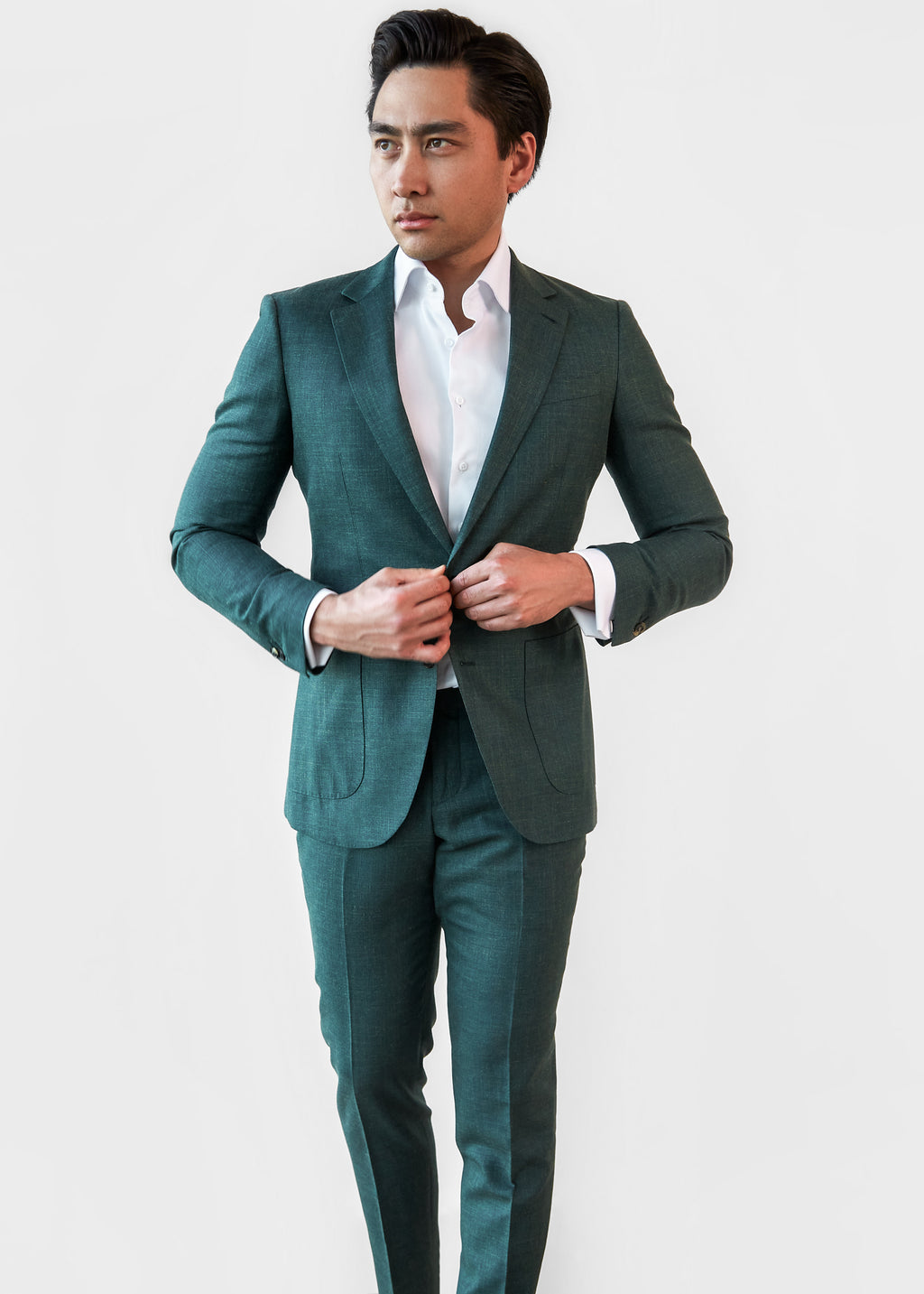 Taylor Square Green Wool-Linen Suit, full front view of a model buttoning the jacket