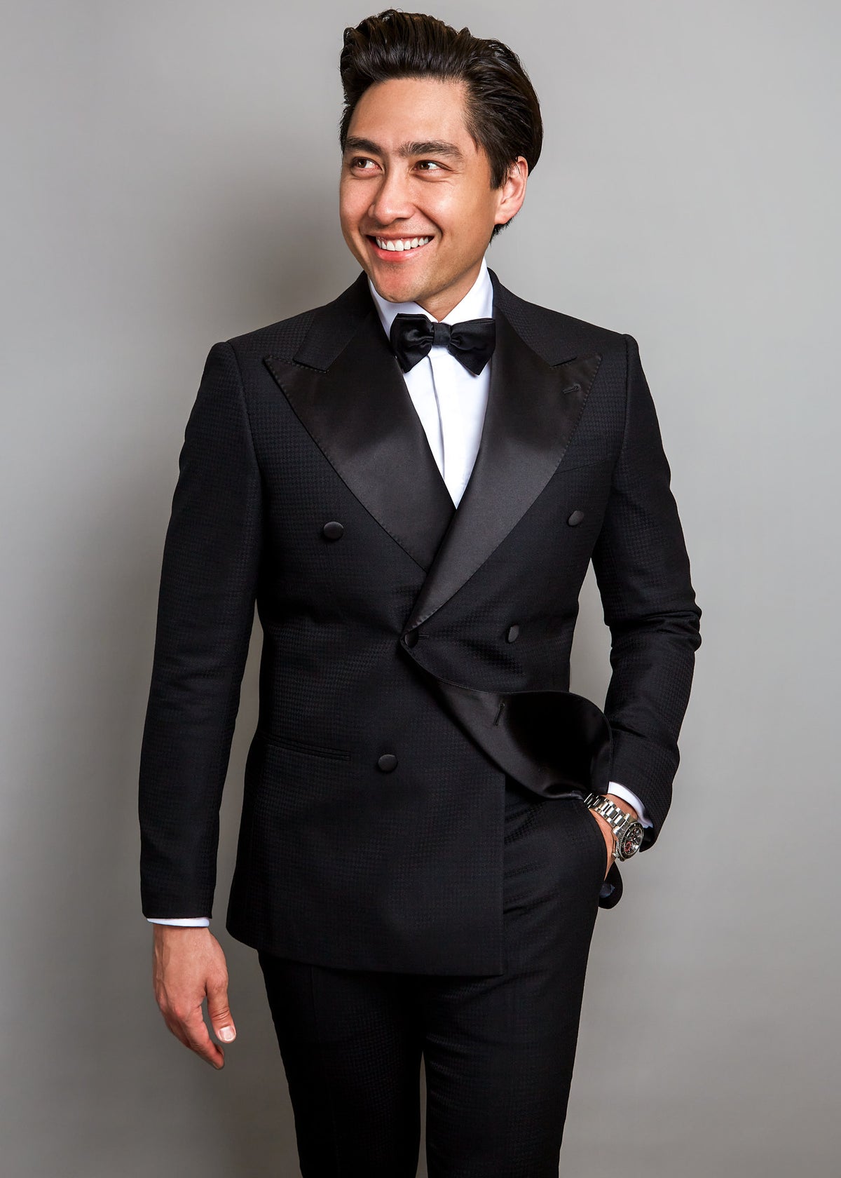 The Monte Carlo Black Tuxedo, full front view on a model with a bow tie