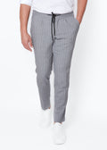 Grey Pinstripe Drawstring Pants worn with a white polo and trainers, front view
