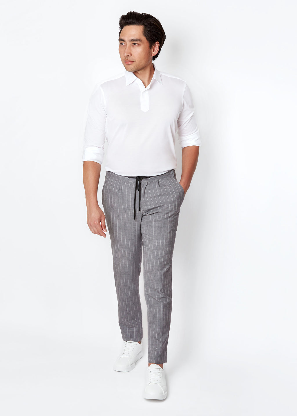 Grey Pinstripe Drawstring Pants worn with a white polo, full-length front view