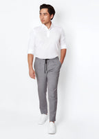 Grey Pinstripe Drawstring Pants worn with a white polo, full-length front view